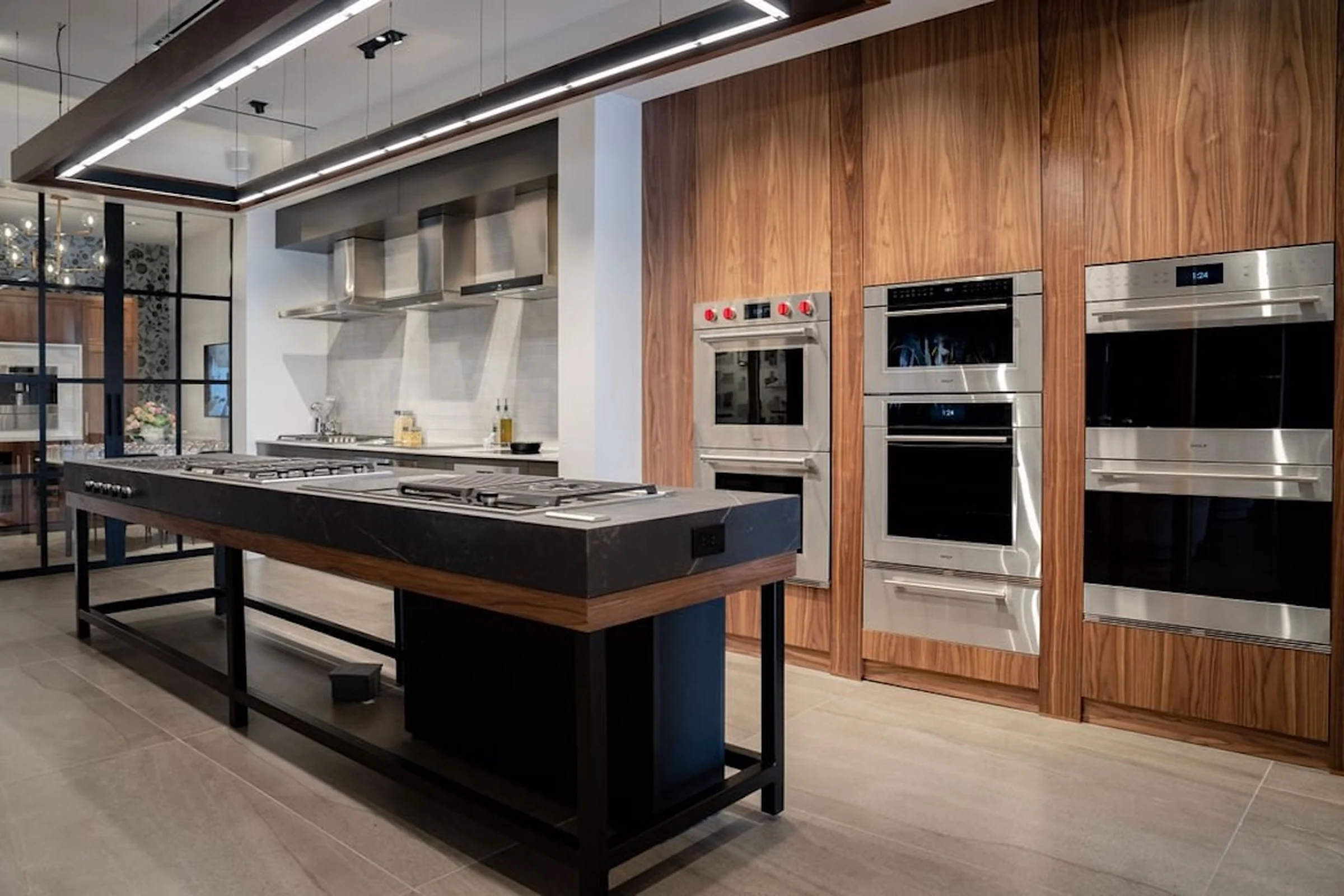 Built-in stainless steel cooking appliances within wood cabinetry.