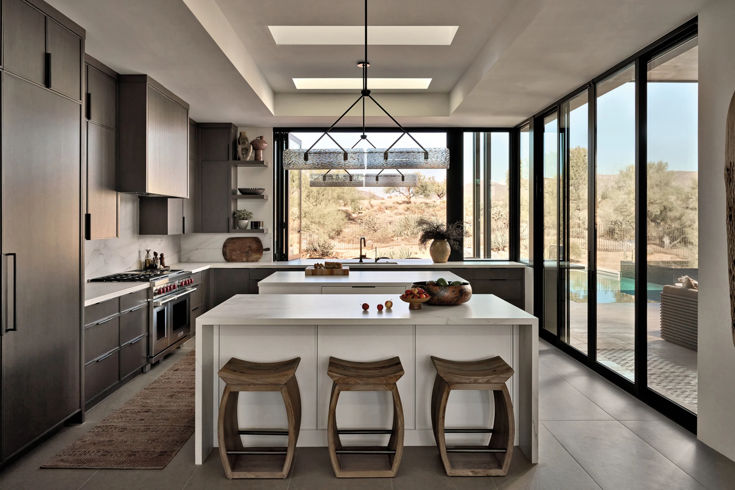 Wood cabinetry in a bright kitchen with a central island.