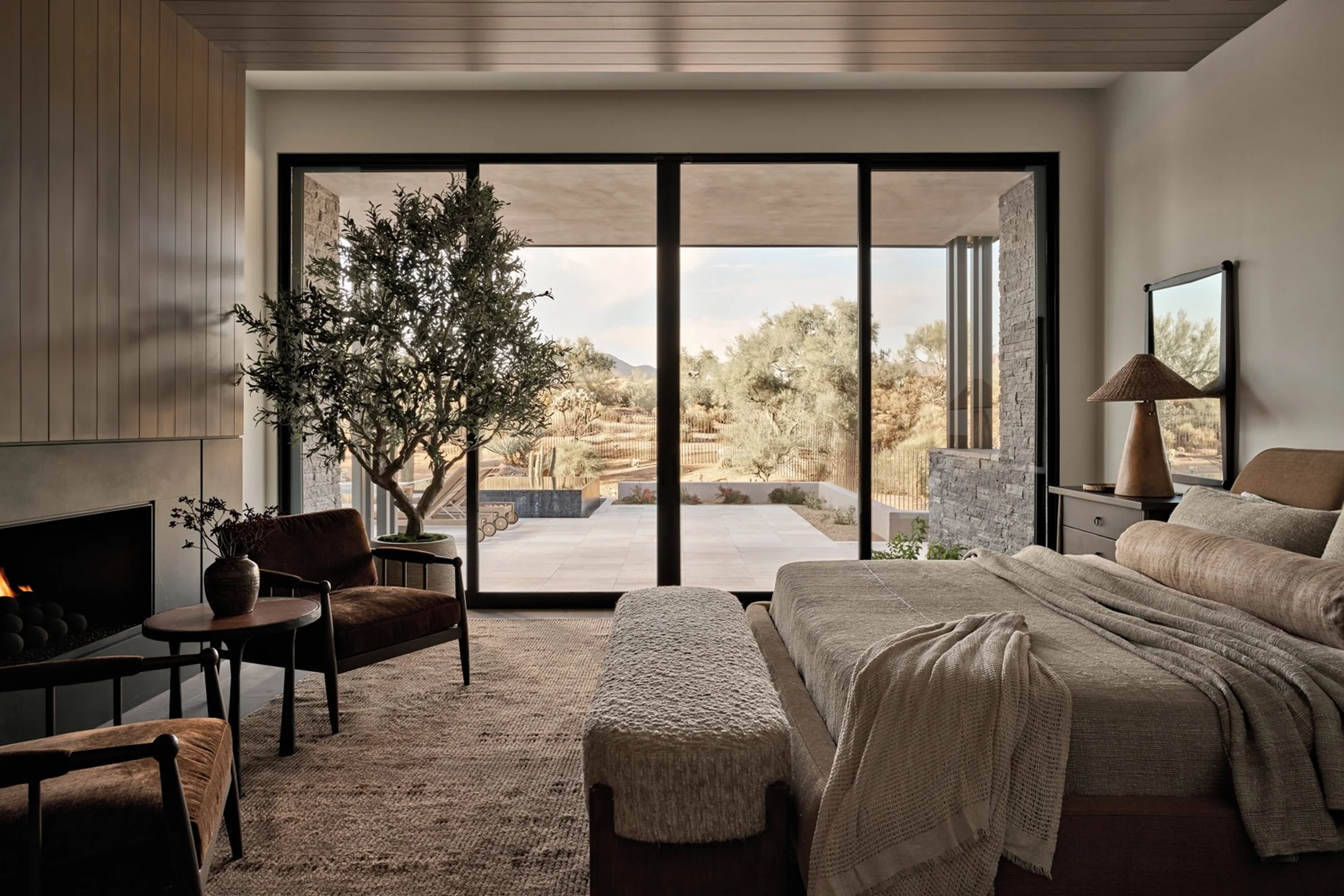 Open glazed patio doors connecting a home to a timber deck.